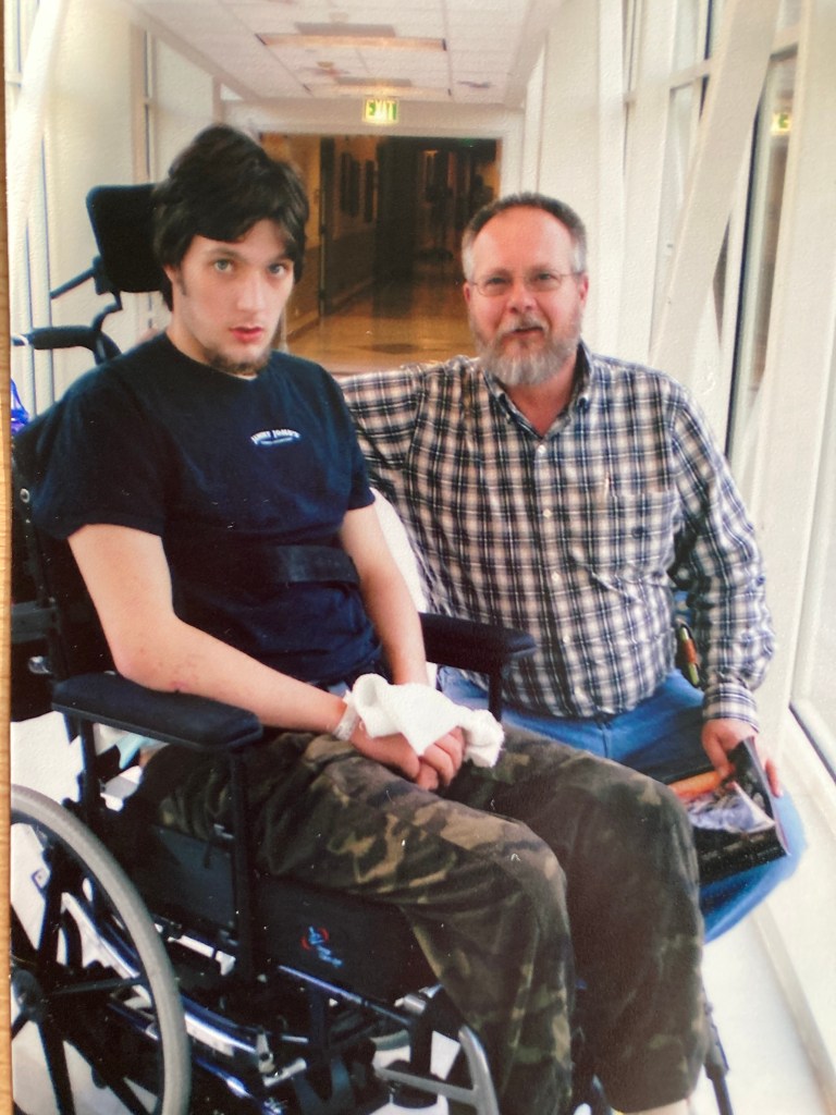 Evan in a wheelchair